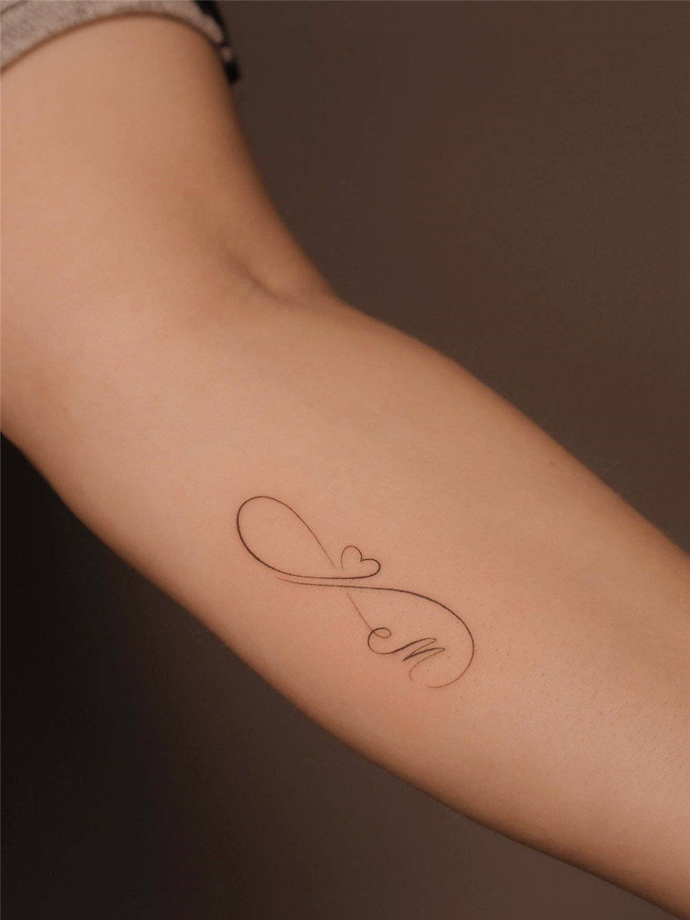 55 Meaningful Fine Line Tattoos for Minimalist Women