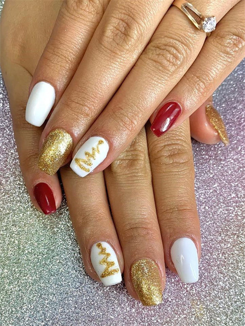 Here we have Christmas nails designs. All of the nails have a different design including snowflakes, reindeer and so on. #WinterNails #ChristmasNails